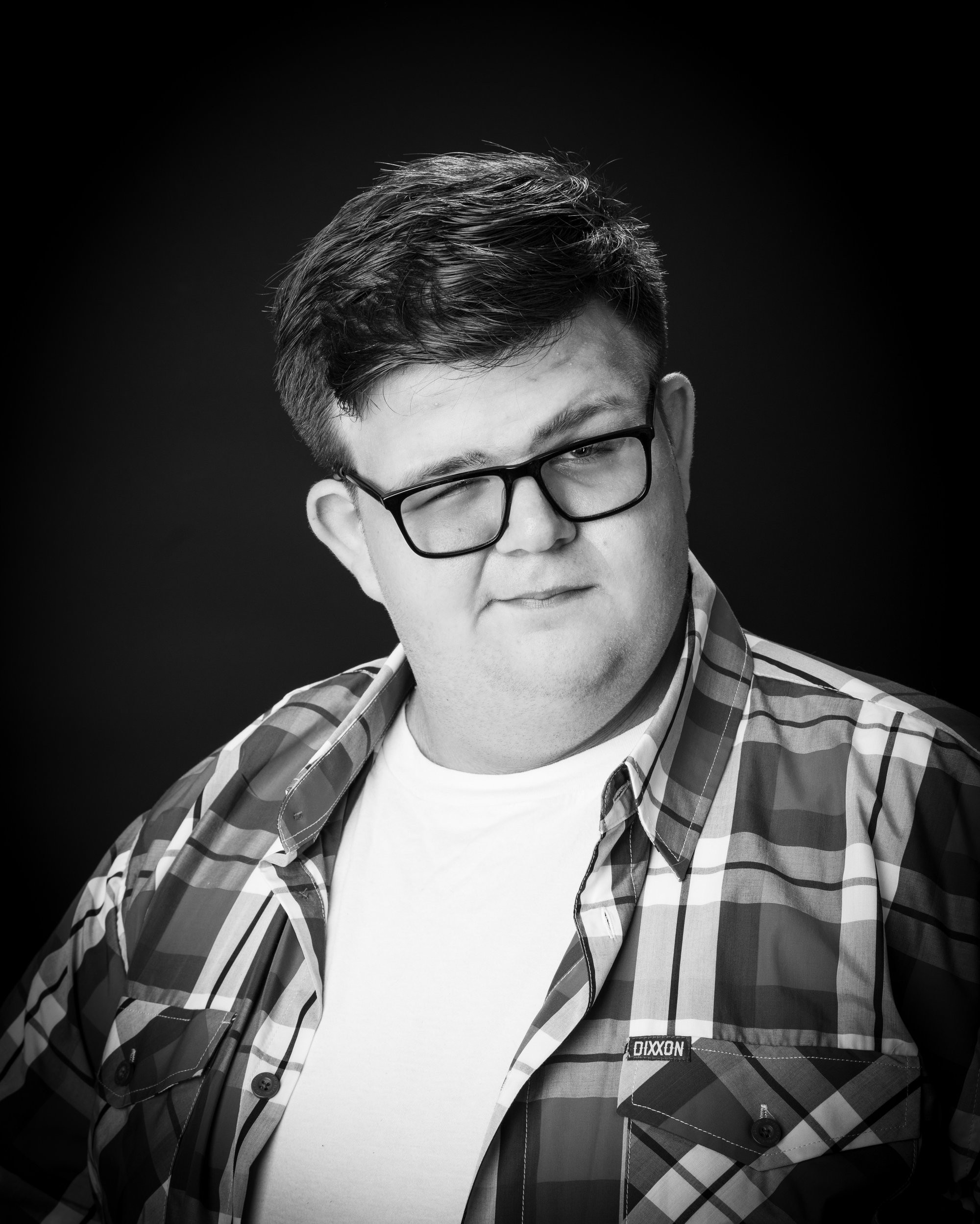 Monochrome senior portrait of Cameron at Allen Park studio