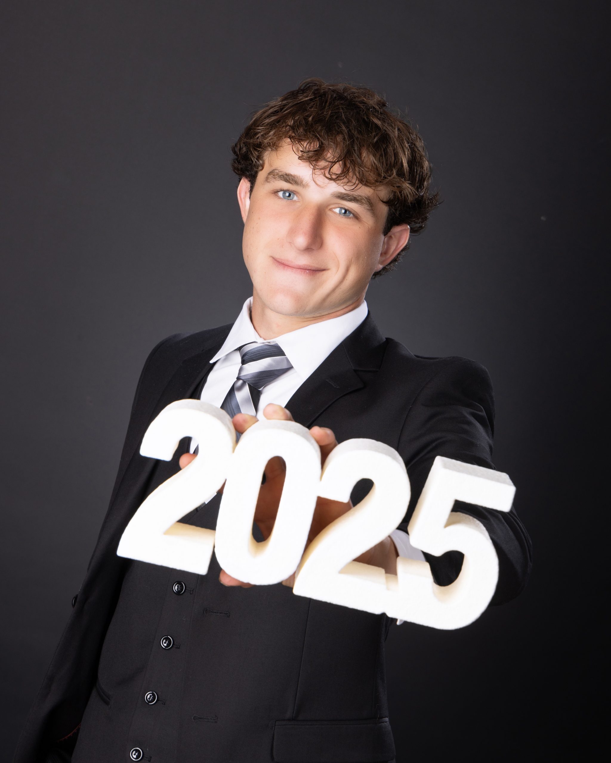 Allen Park Senior Cody 2025 holding '2025' numbers in studio session