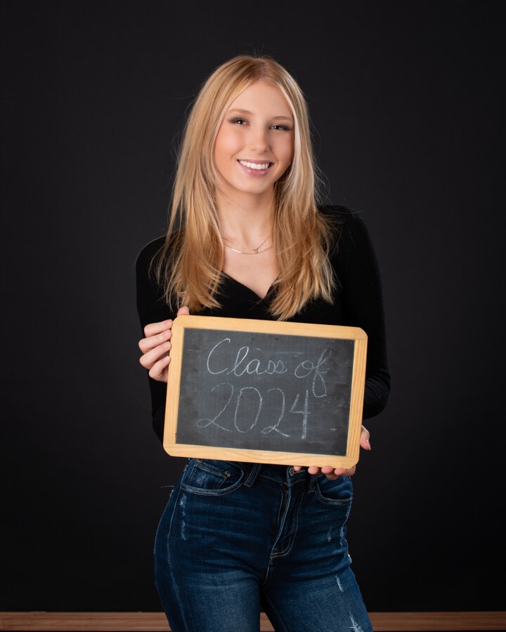 Downriver senior photography session with natural lighting and studio backdrop