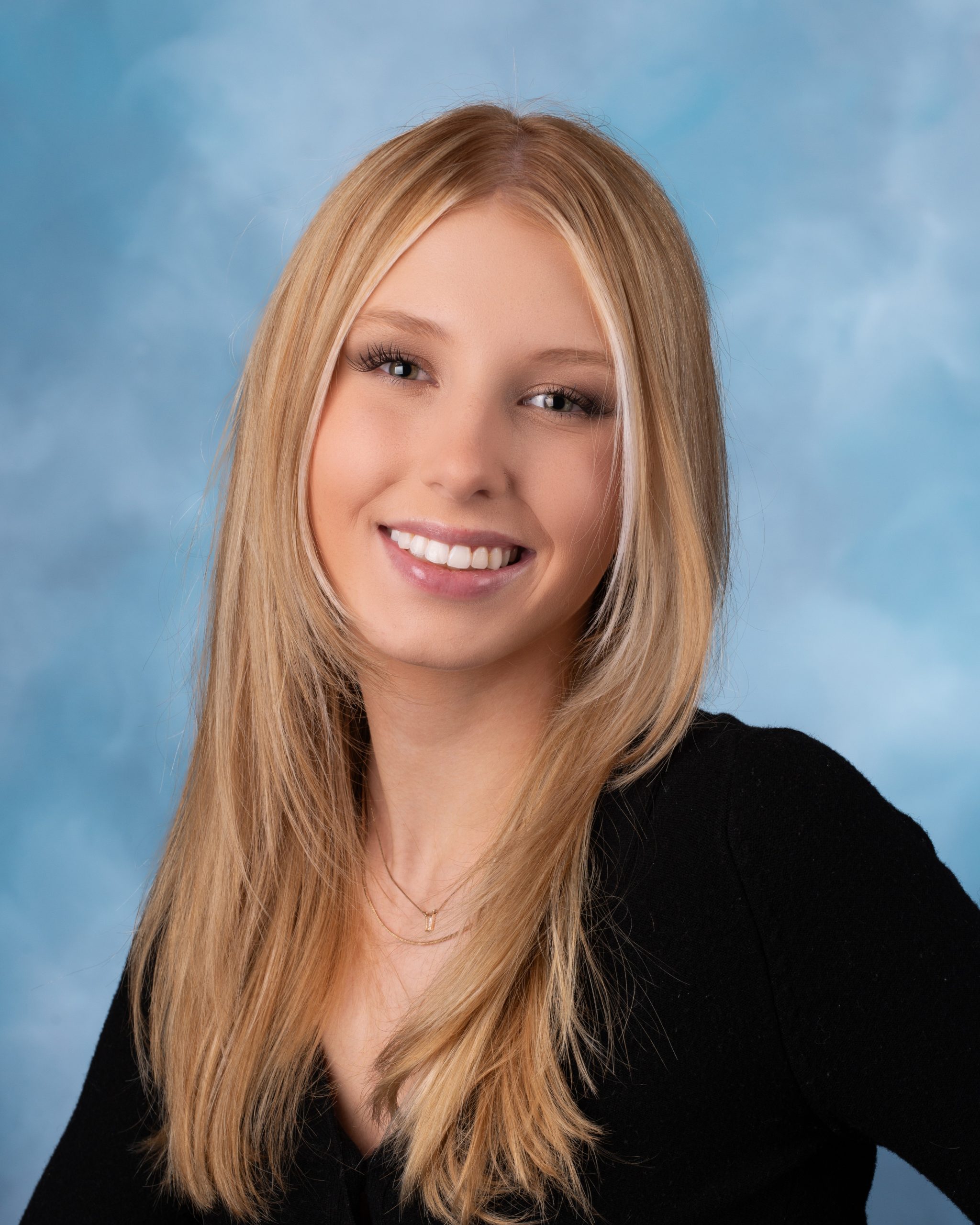Downriver senior photography session with natural lighting and studio backdrop