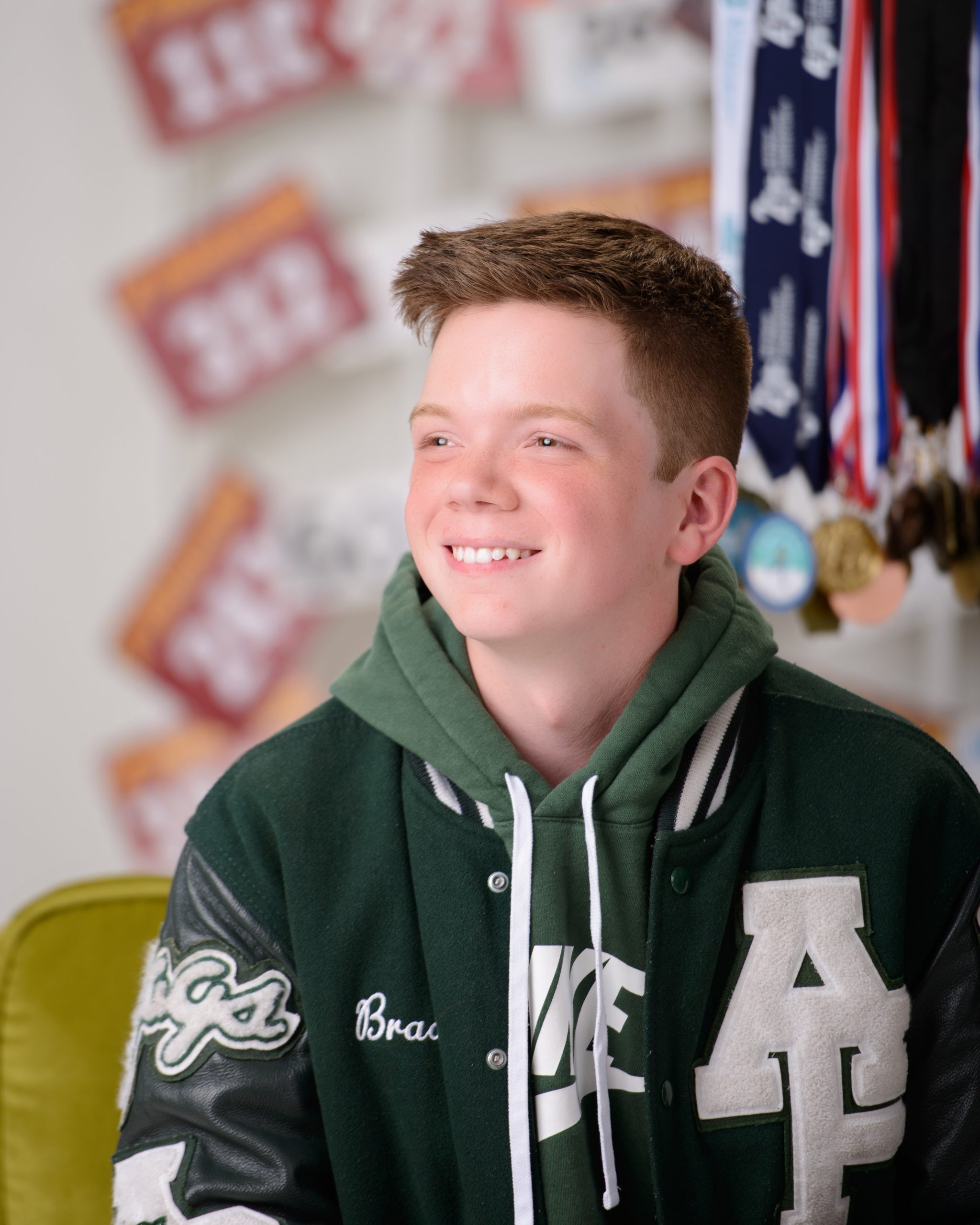 Allen Park senior track runner wearing varsity jacket and tie