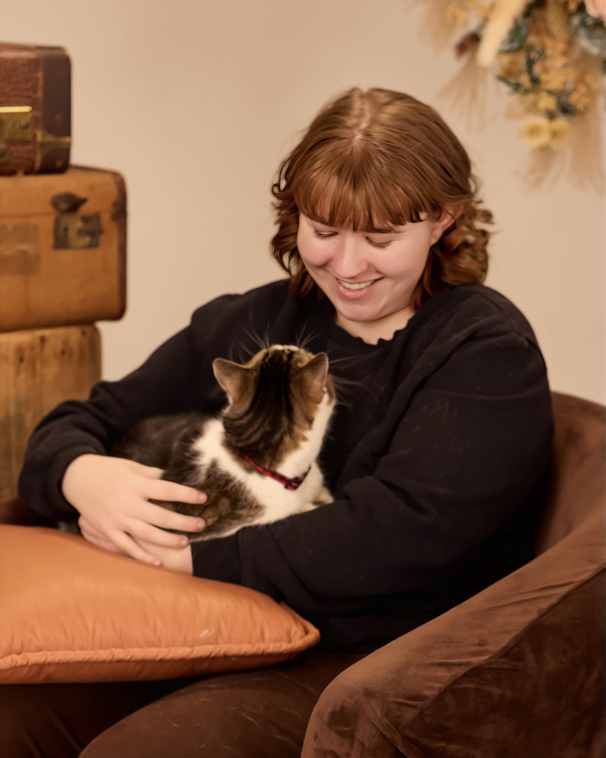 Evelyn holding a calico cat during Allen Park senior photo session
