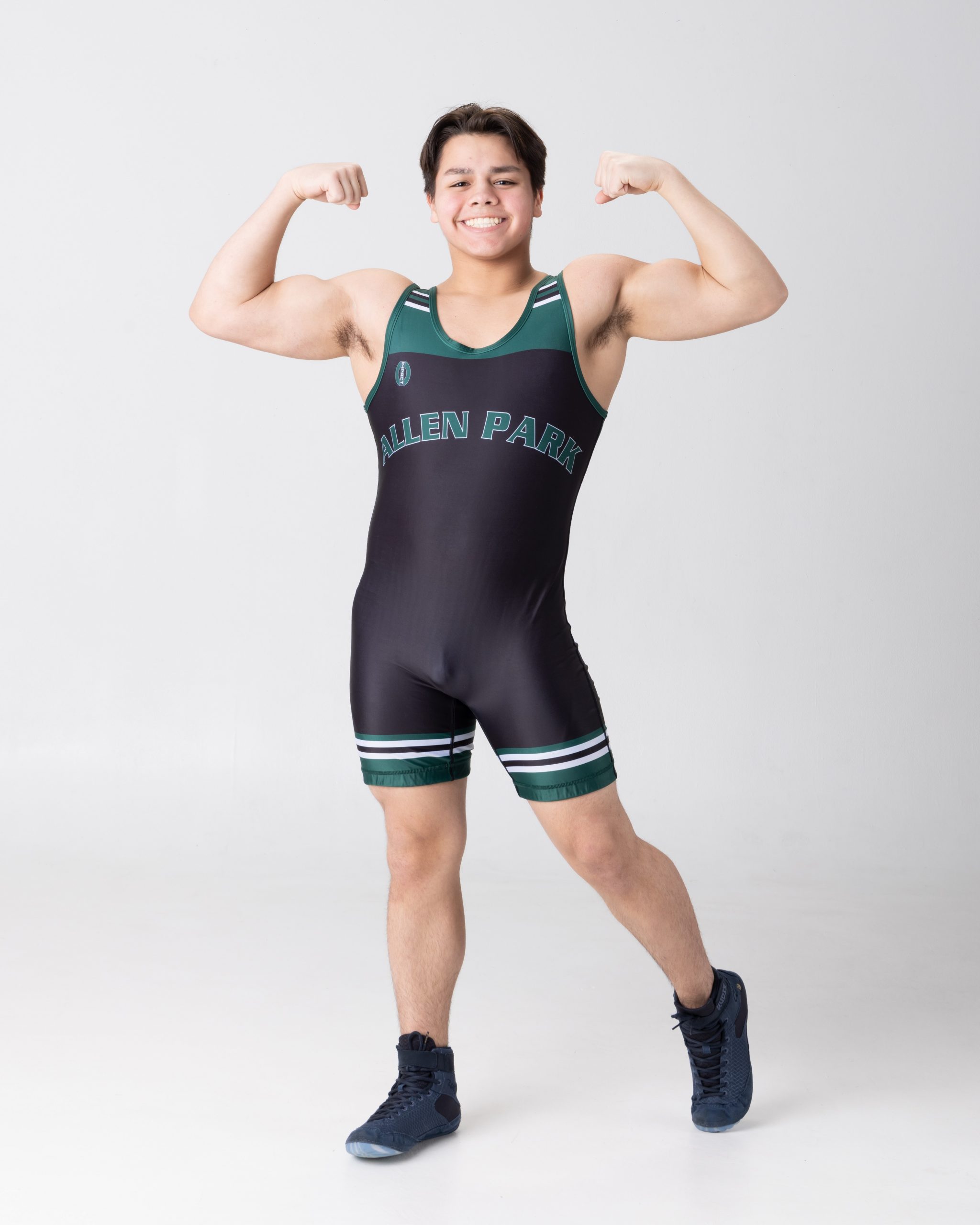 Allen Park wrestler flexing arms in studio portrait