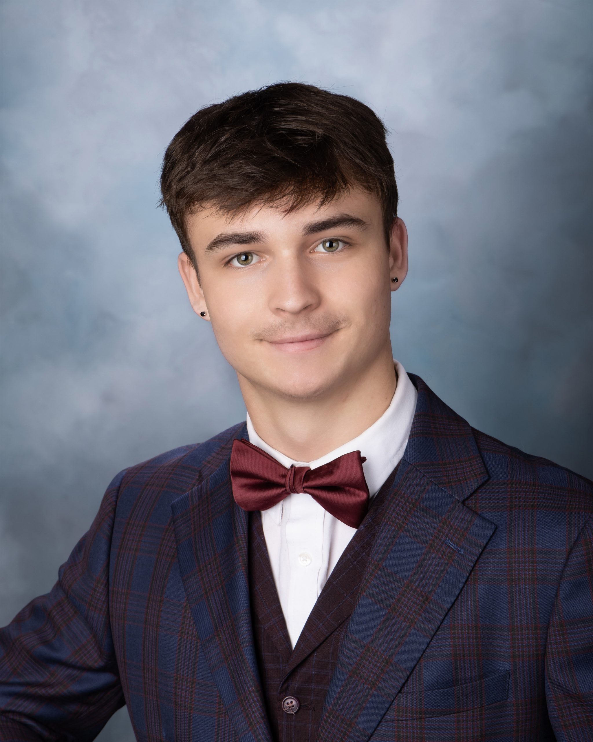 Cabrini Senior Vance formal portrait in blue plaid suit and maroon bow tie, Wyandotte studio photography