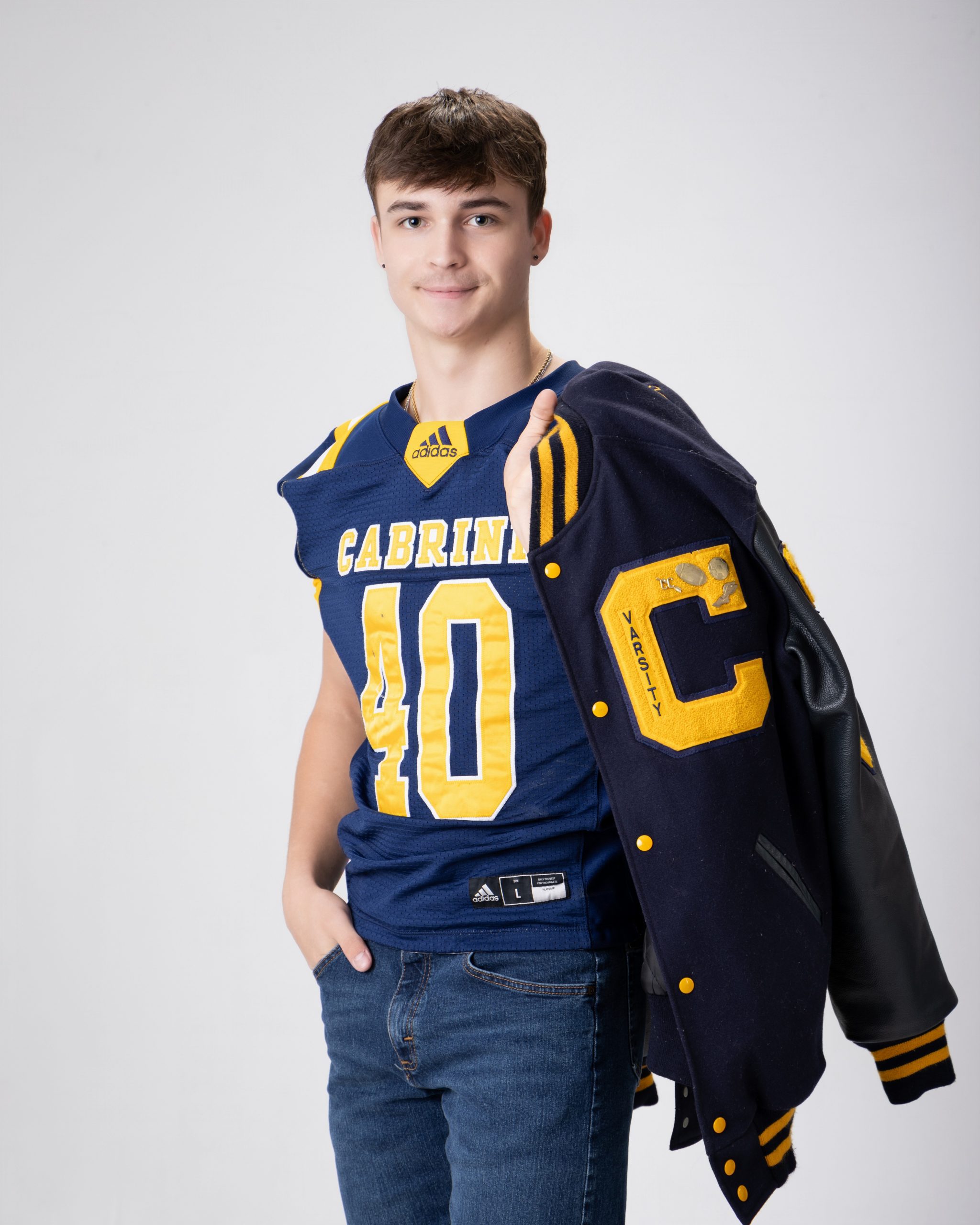 Cabrini Senior Vance sports jersey and jacket, blue and gold school colors, Downriver photo session
