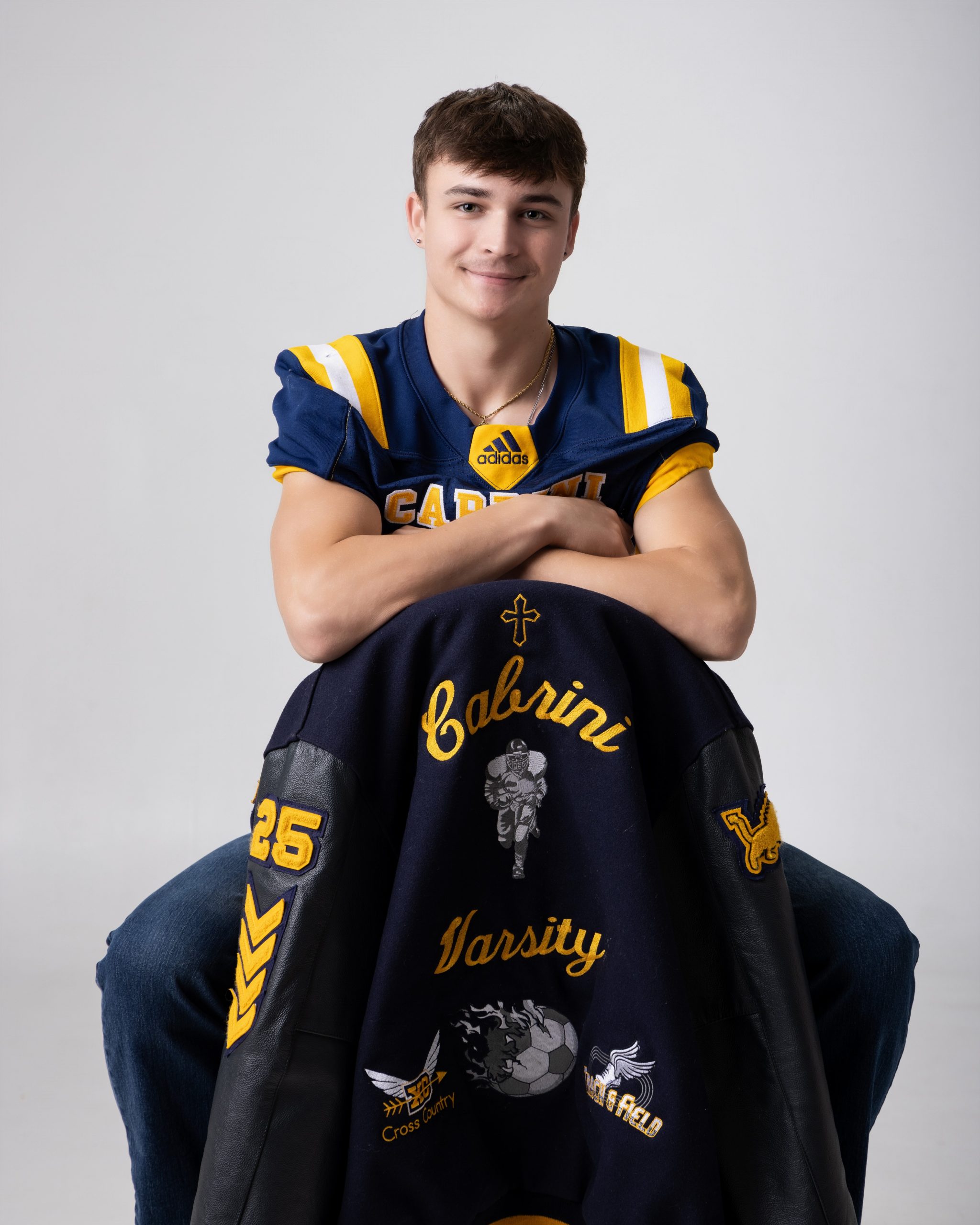 Cabrini Senior Vance sports jersey and jacket, blue and gold school colors, Downriver photo session