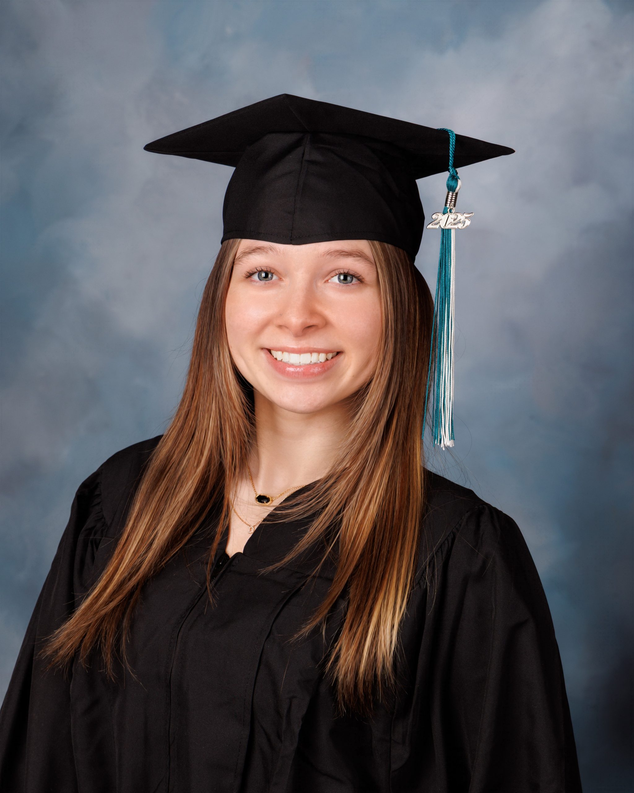 Hailey wearing graduation gown and cap for Canton Plymouth senior photography session