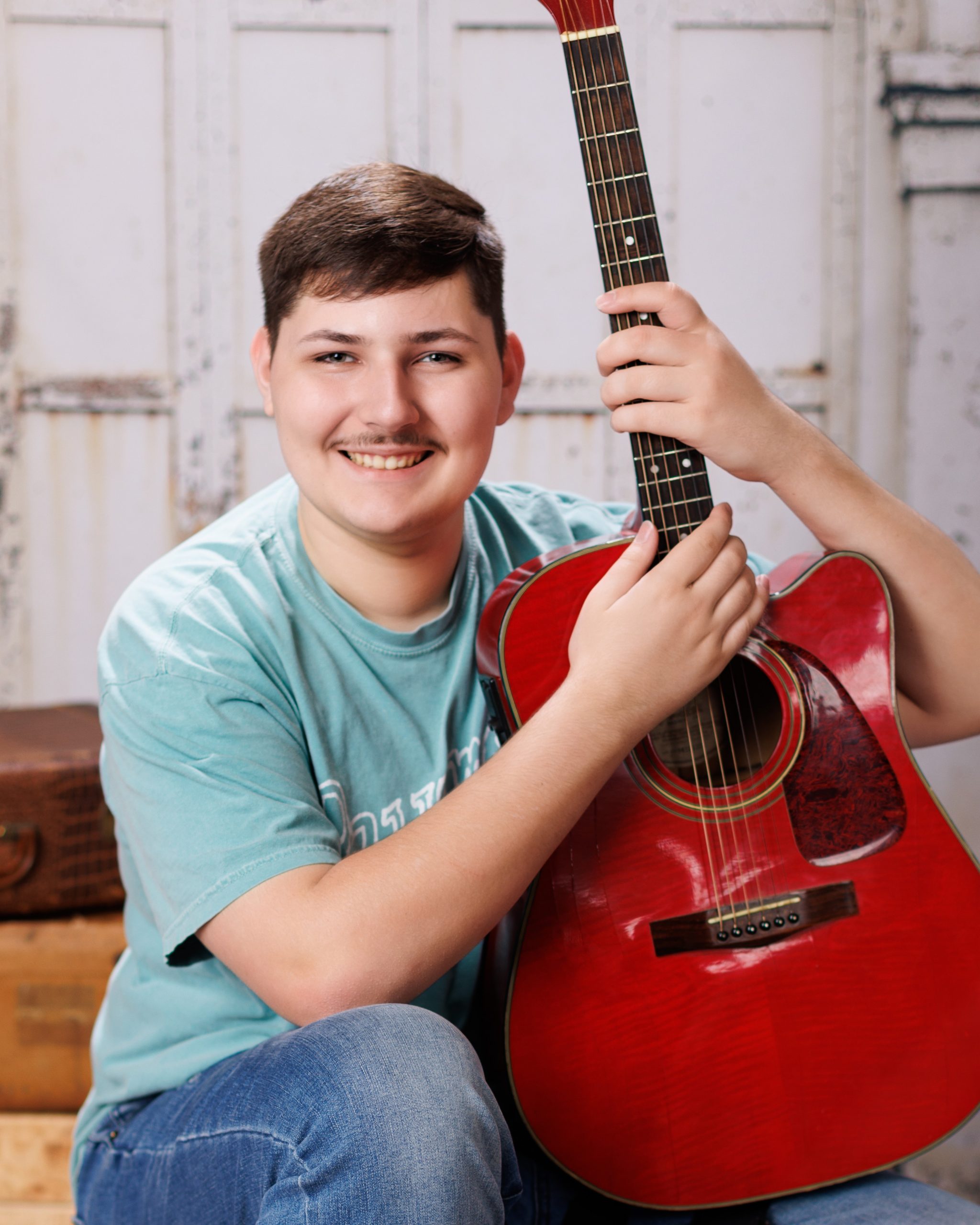 Tobias drumming professionally in formal attire during Dearborn senior photography session