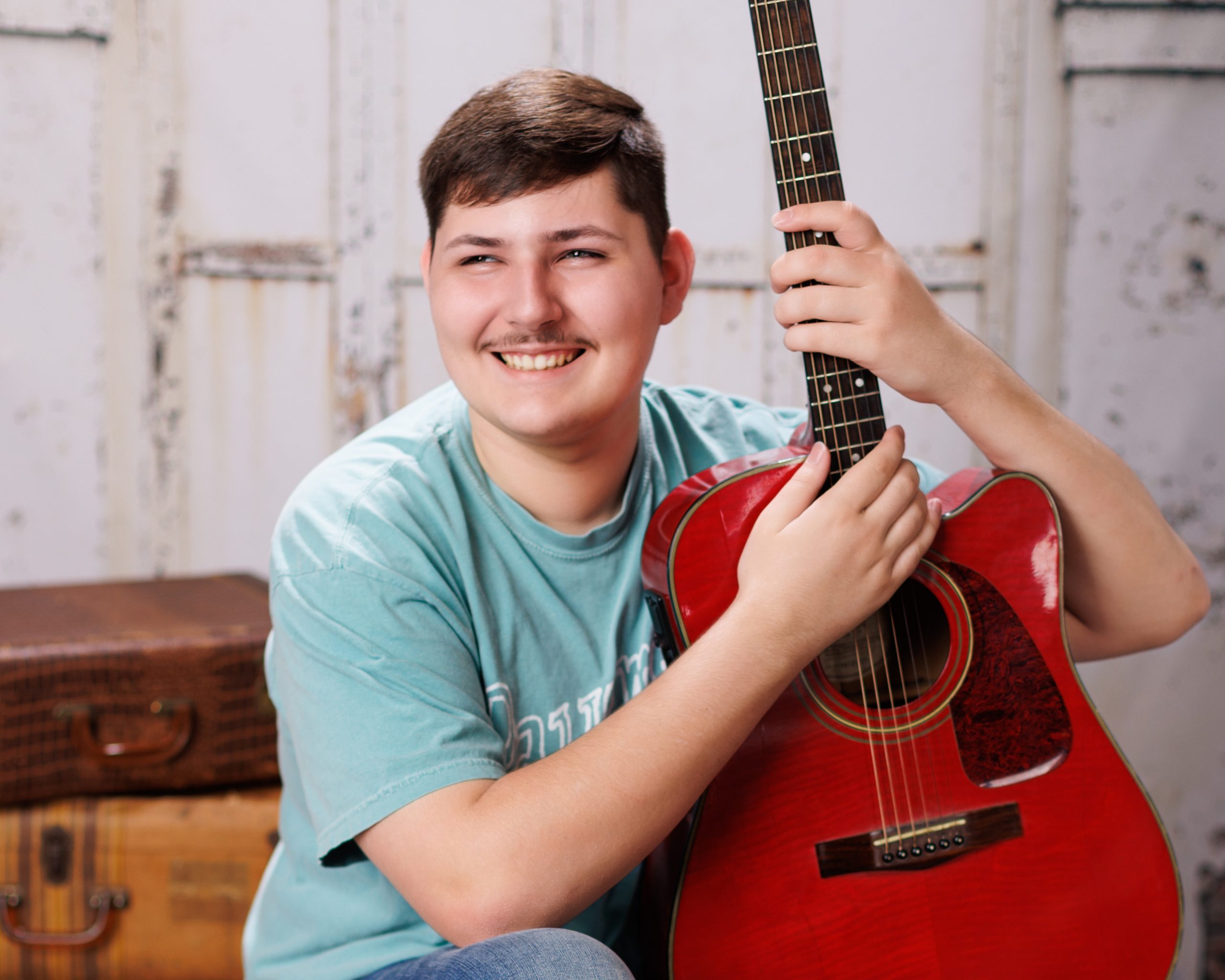 Tobias drumming professionally in formal attire during Dearborn senior photography session