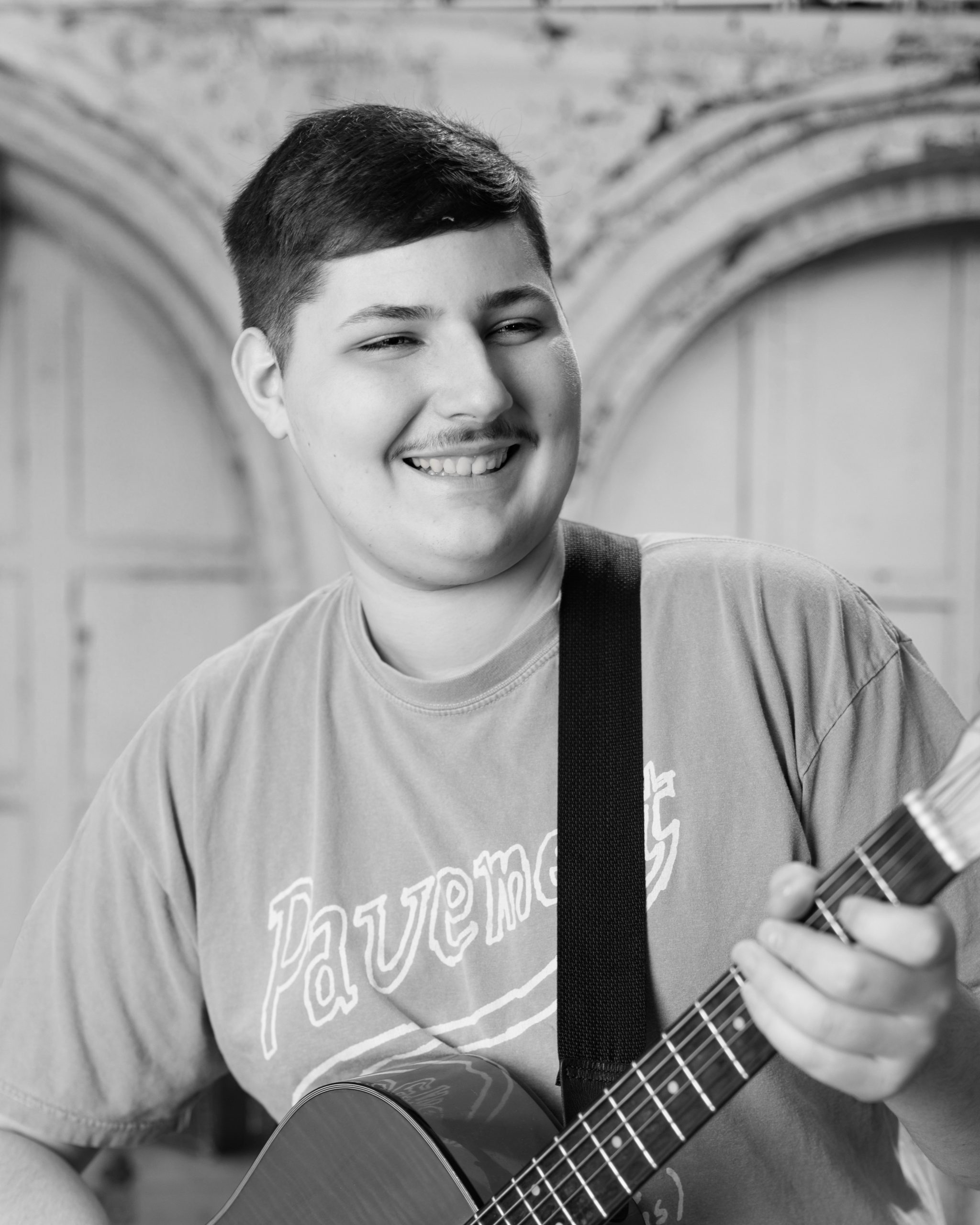 Tobias drumming professionally in formal attire during Dearborn senior photography session