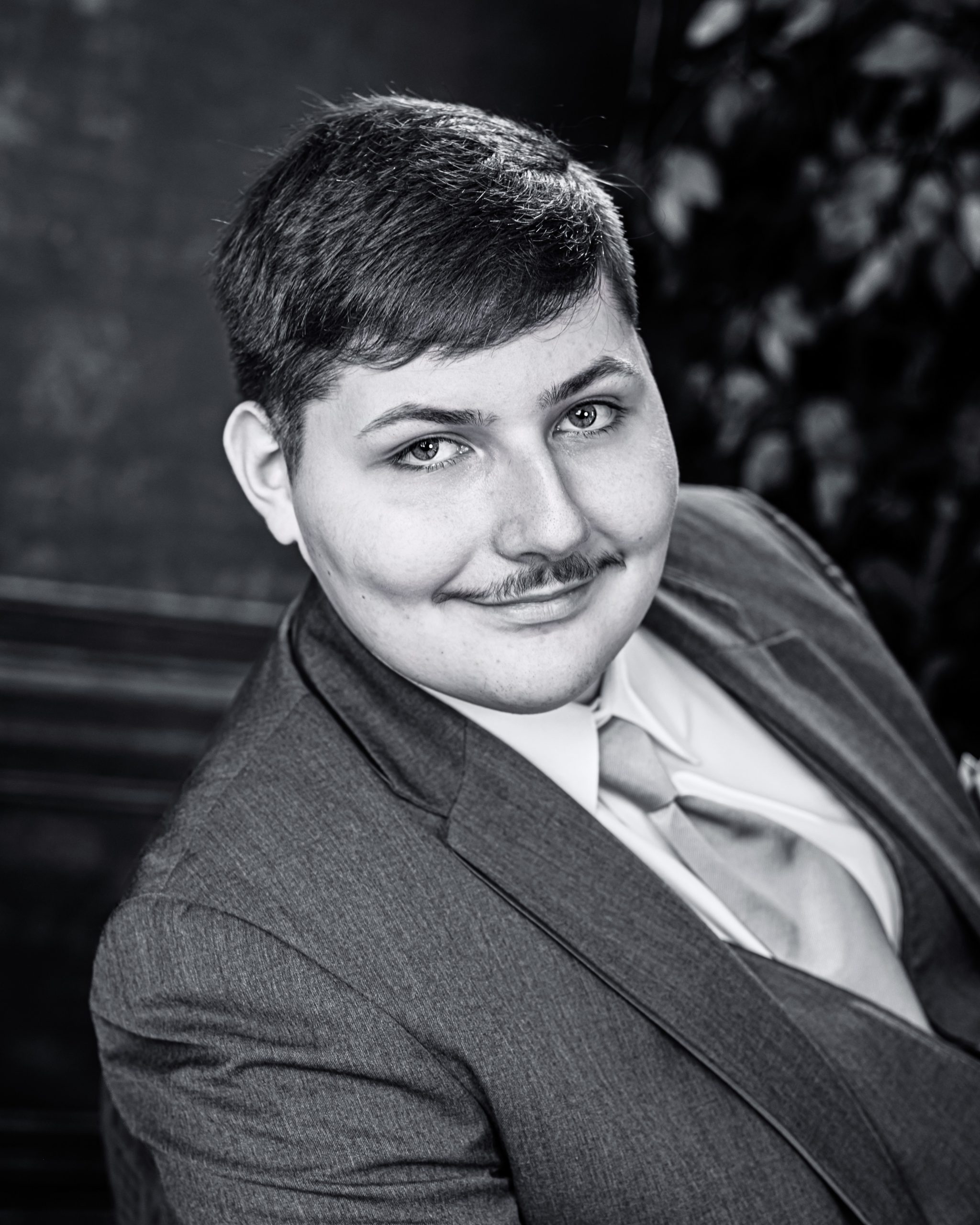 Tobias drumming professionally in formal attire during Dearborn senior photography session