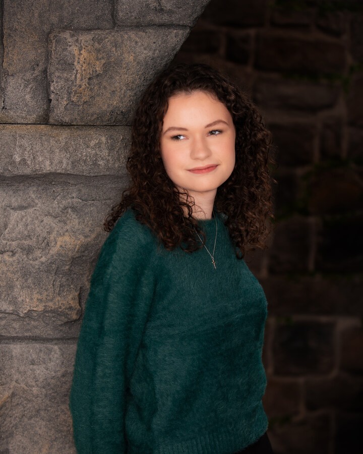 Graduation gown portrait of a senior student for Downriver studio shoot