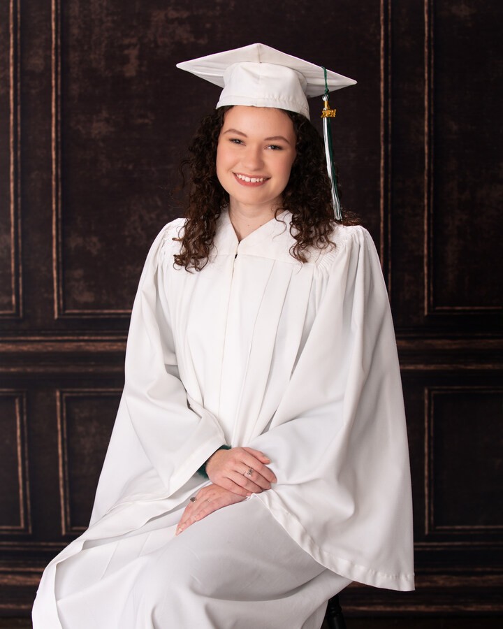 Graduation gown portrait of a senior student for Downriver studio shoot