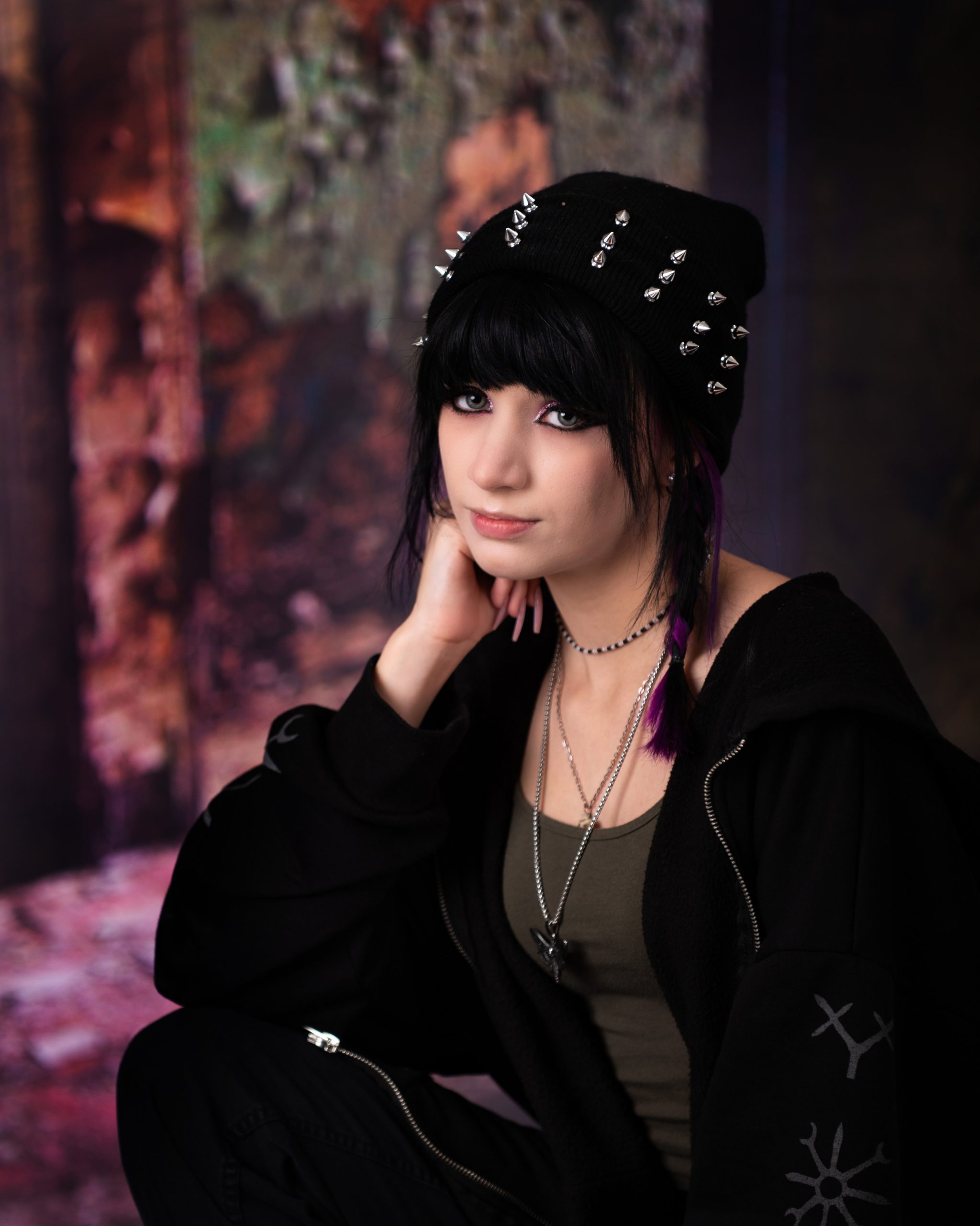 Close-up of Ashley's gothic makeup and black hair with purple highlights for Downriver senior photography