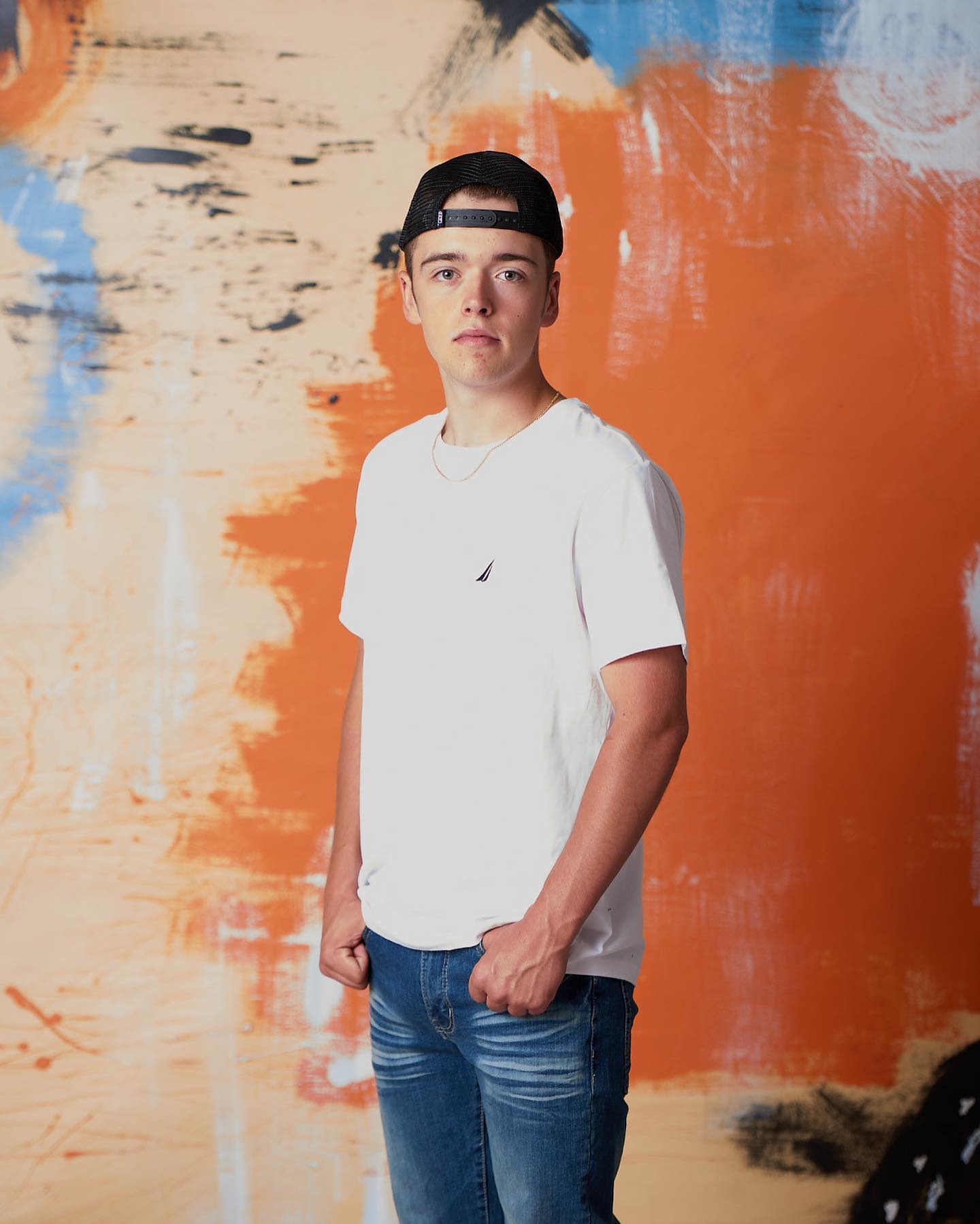 NEW BACKGROUND ALERT! Now Offering our latest custom painted background in-studio called "ORANGE SPLASH" . Book your session today - LINK IN BIO — image 1 of 2