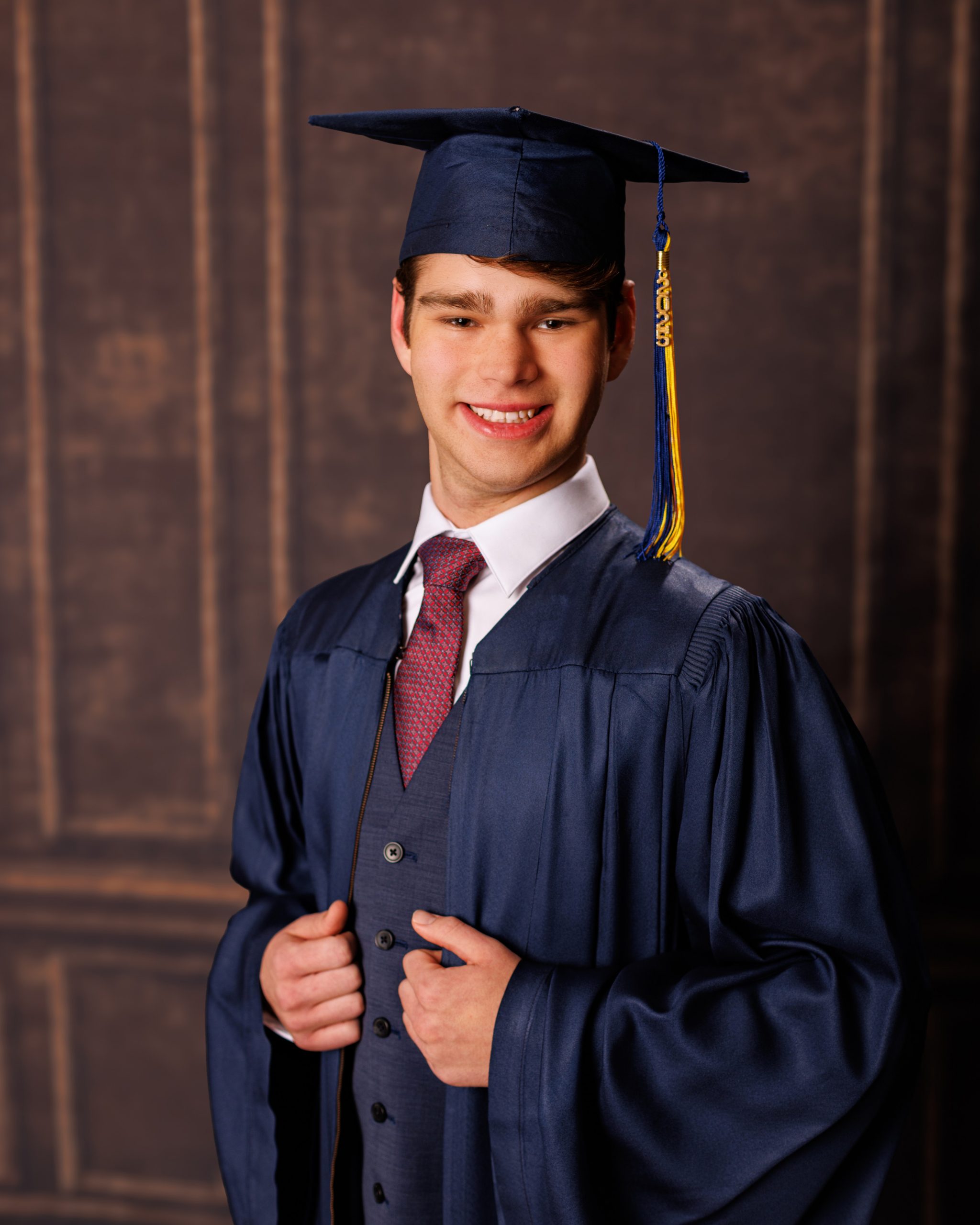 Formal senior photo of Jefferson High School student in navy suit and tie