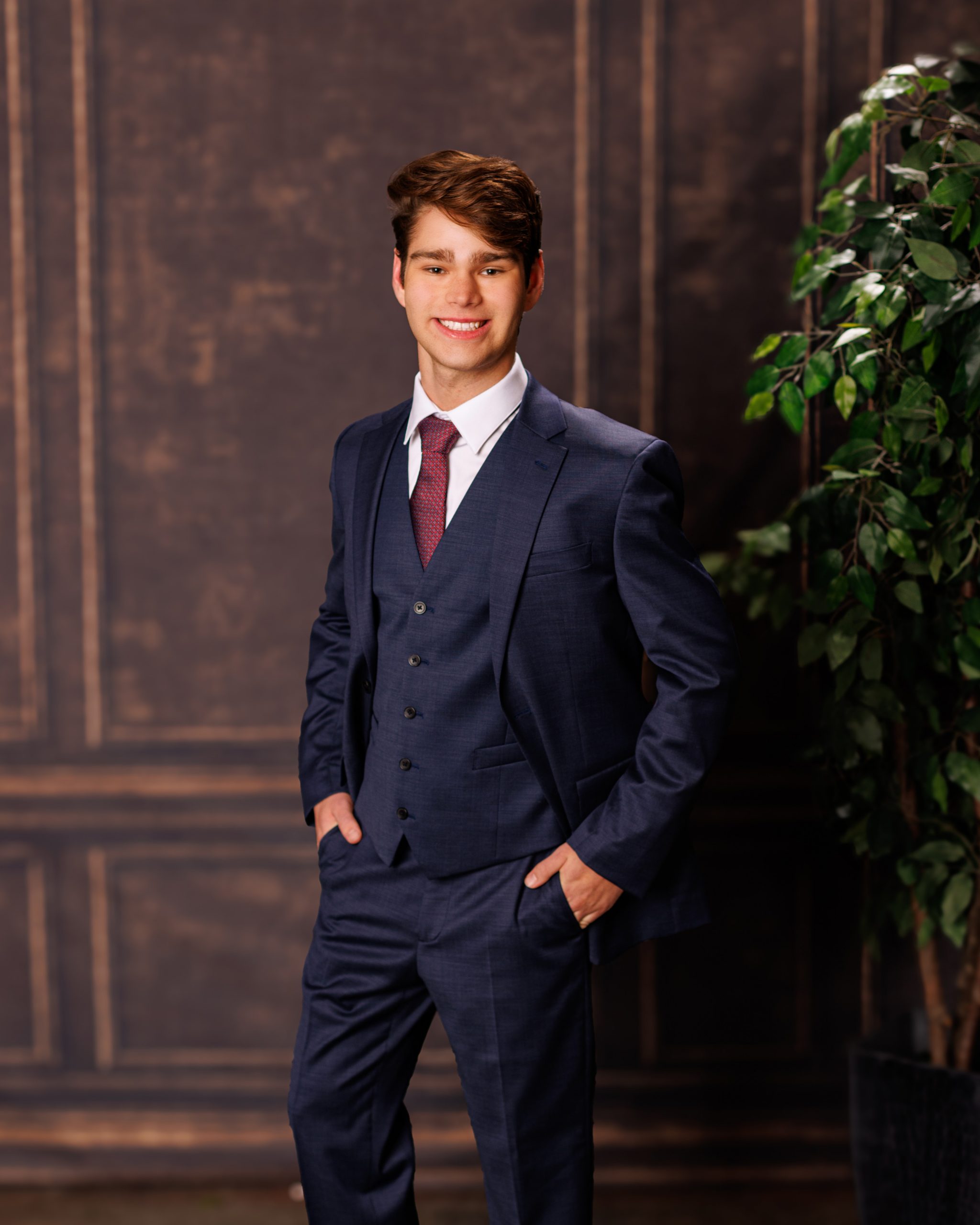 Formal senior photo of Jefferson High School student in navy suit and tie