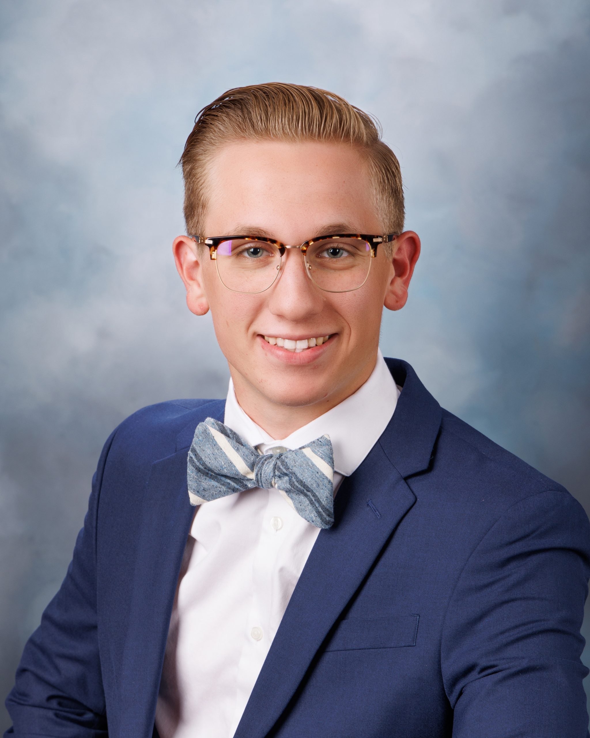 Plymouth senior photo session headshot of student in blue suit and striped bow tie