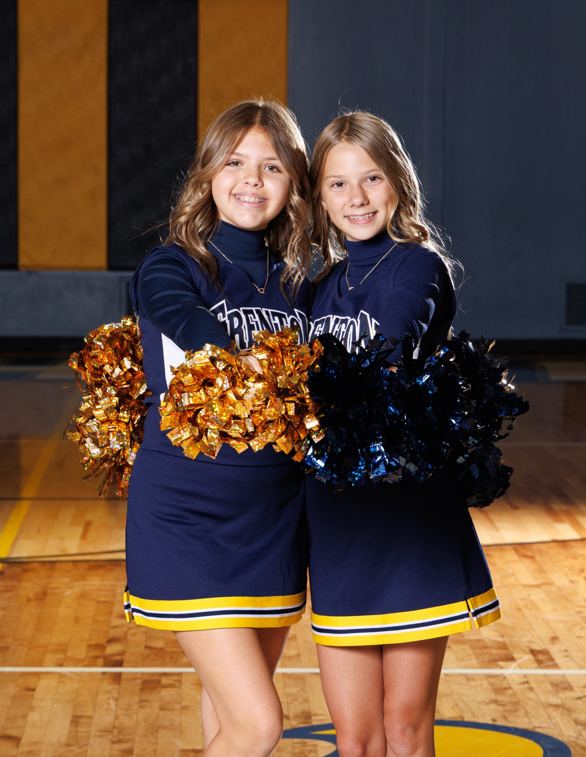 Trenton cheerleader lying on court with raised legs