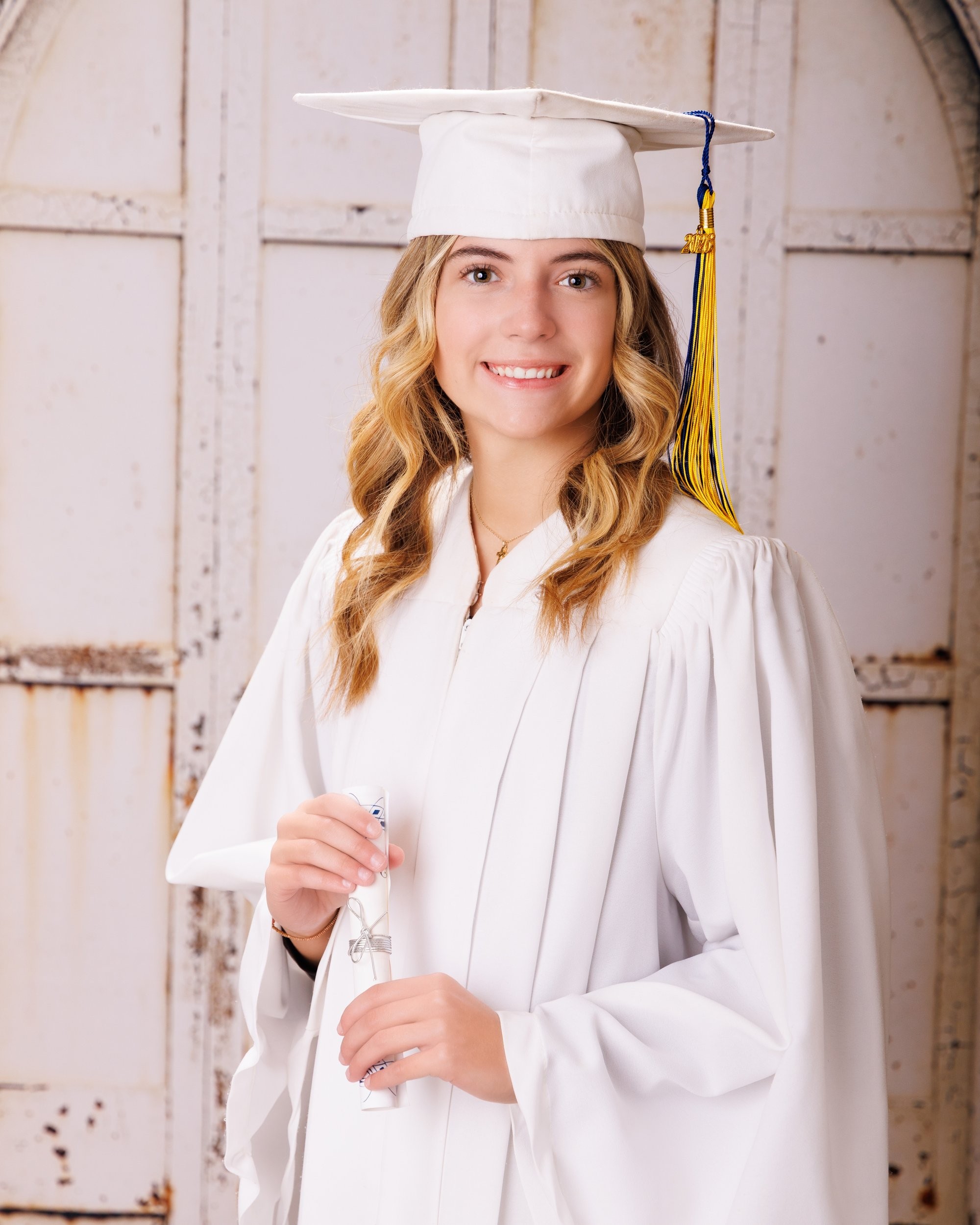 Trenton senior portraits session showing student in casual attire with graduation cap backdrop