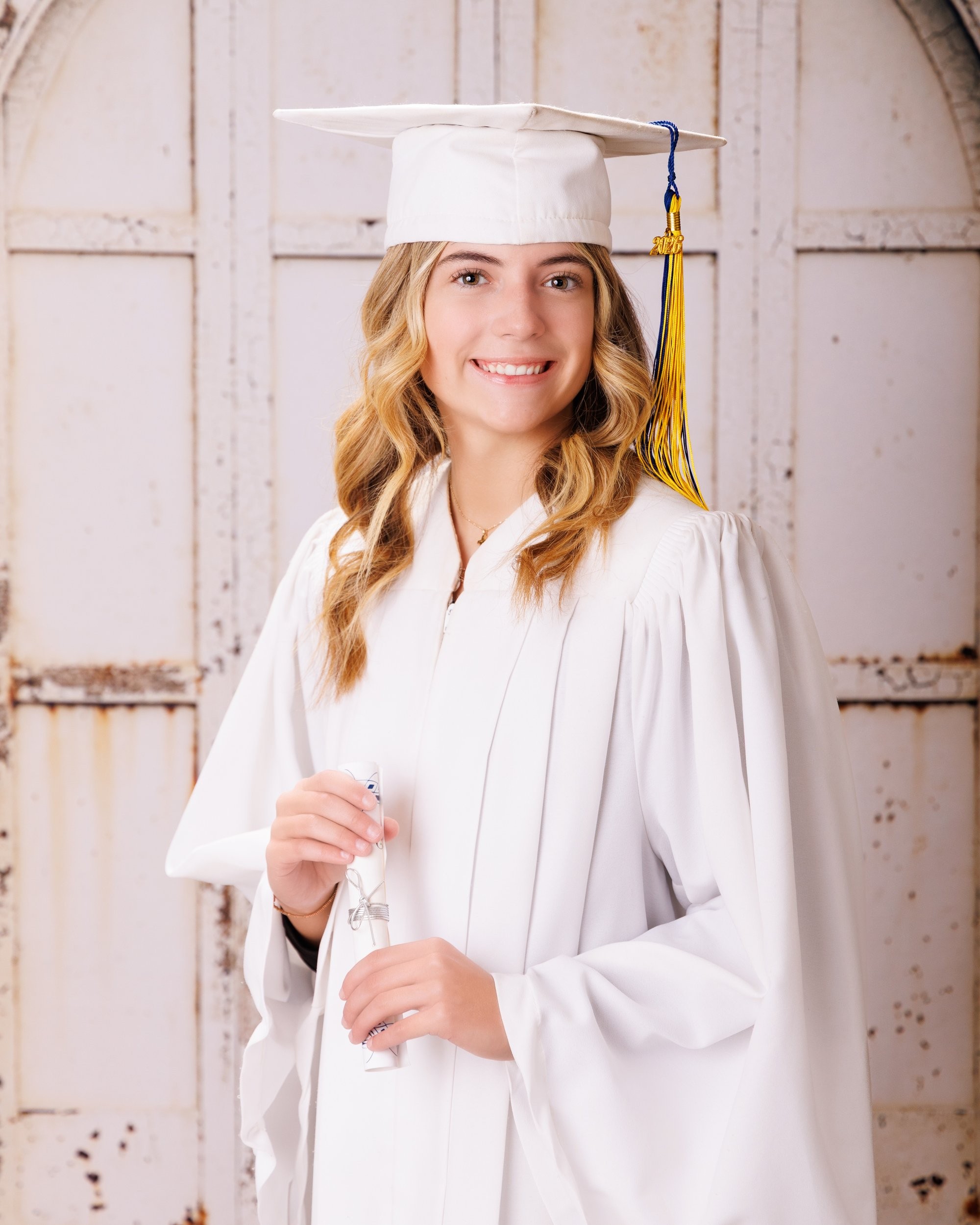 Trenton senior portraits session showing student in casual attire with graduation cap backdrop