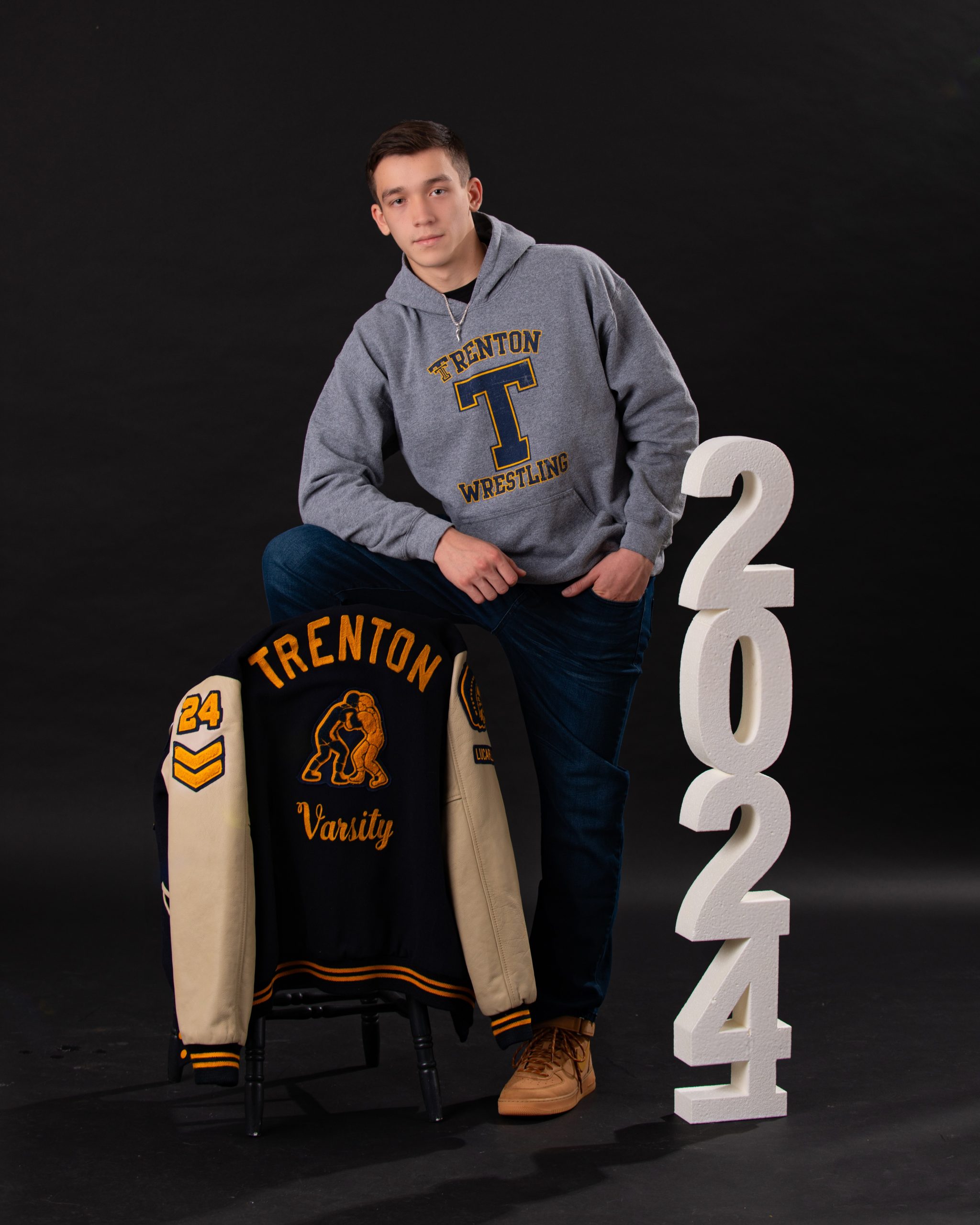 Casual Trenton senior photography with Jordan sweatshirt and Nike pants