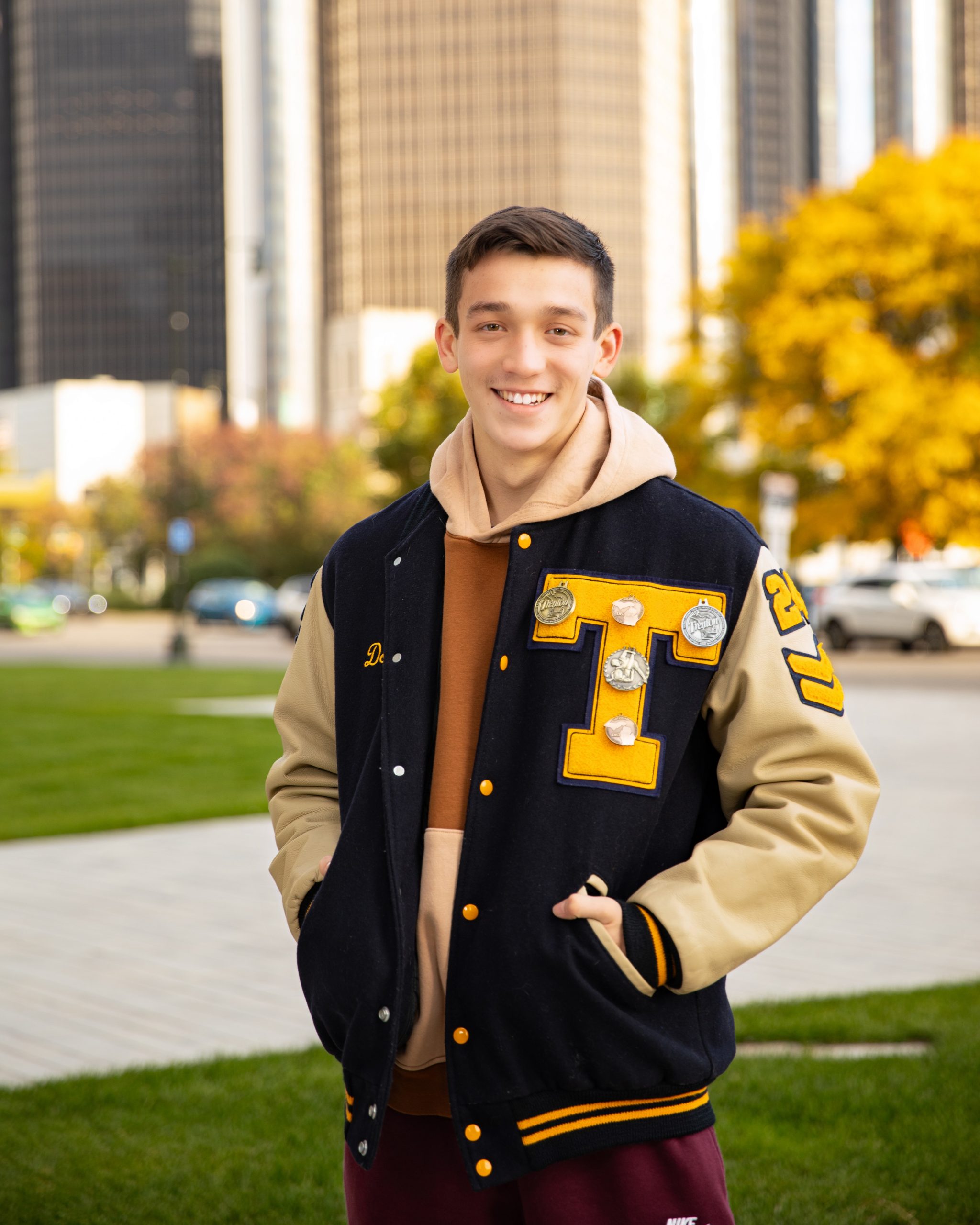 Casual Trenton senior photography with Jordan sweatshirt and Nike pants