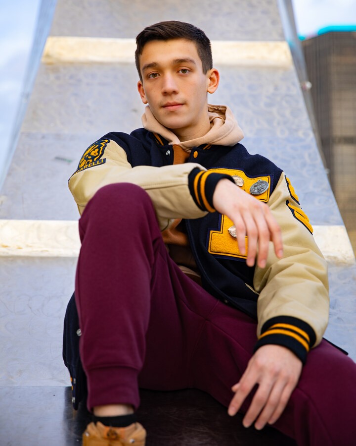 Casual Trenton senior photography with Jordan sweatshirt and Nike pants
