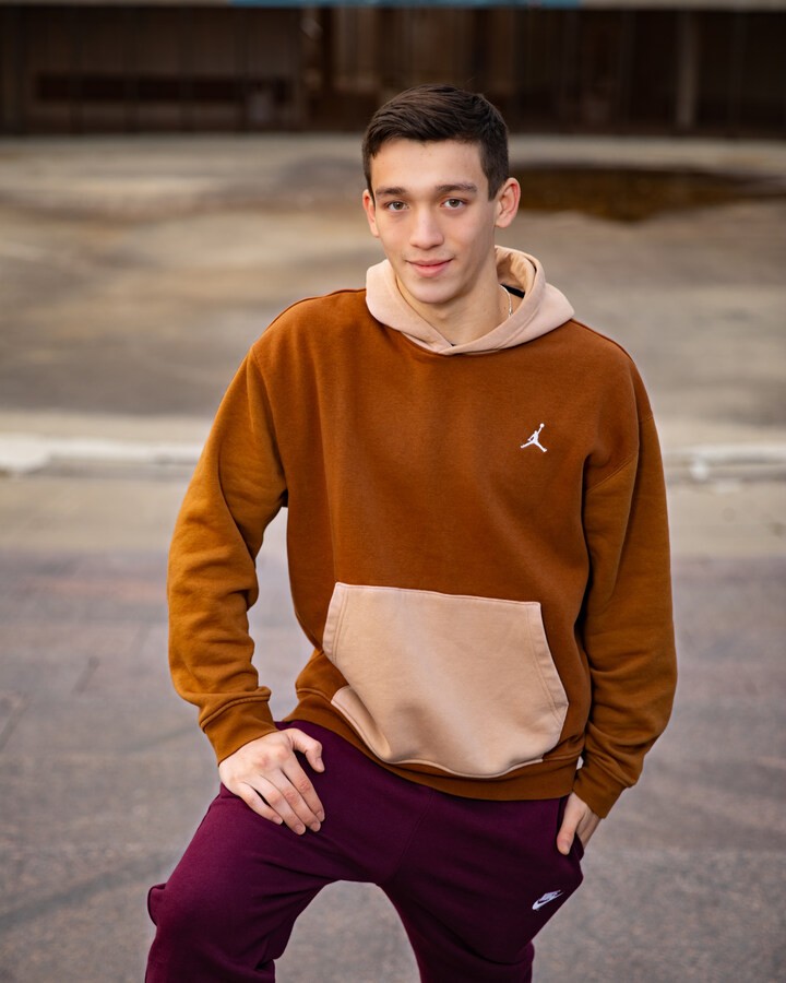 Casual Trenton senior photography with Jordan sweatshirt and Nike pants