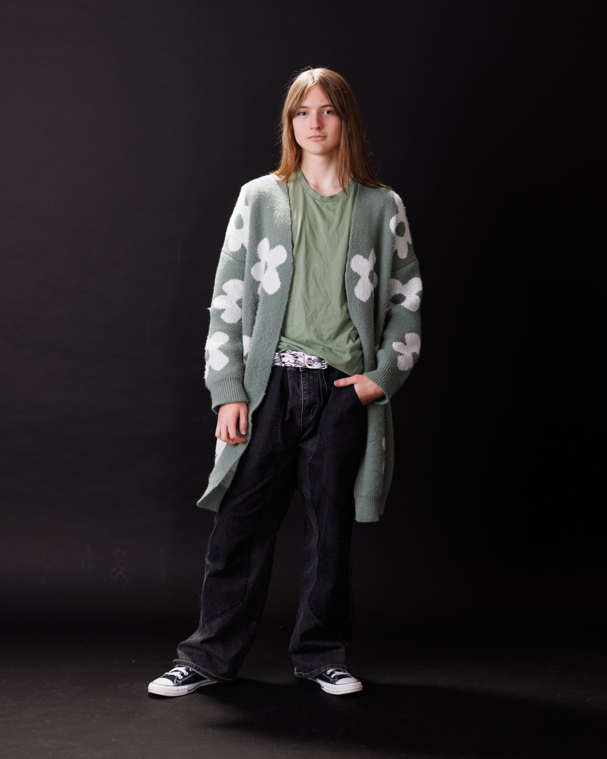 Patrick's senior photography session in Trenton with a long-sleeve floral cardigan and relaxed fit jeans