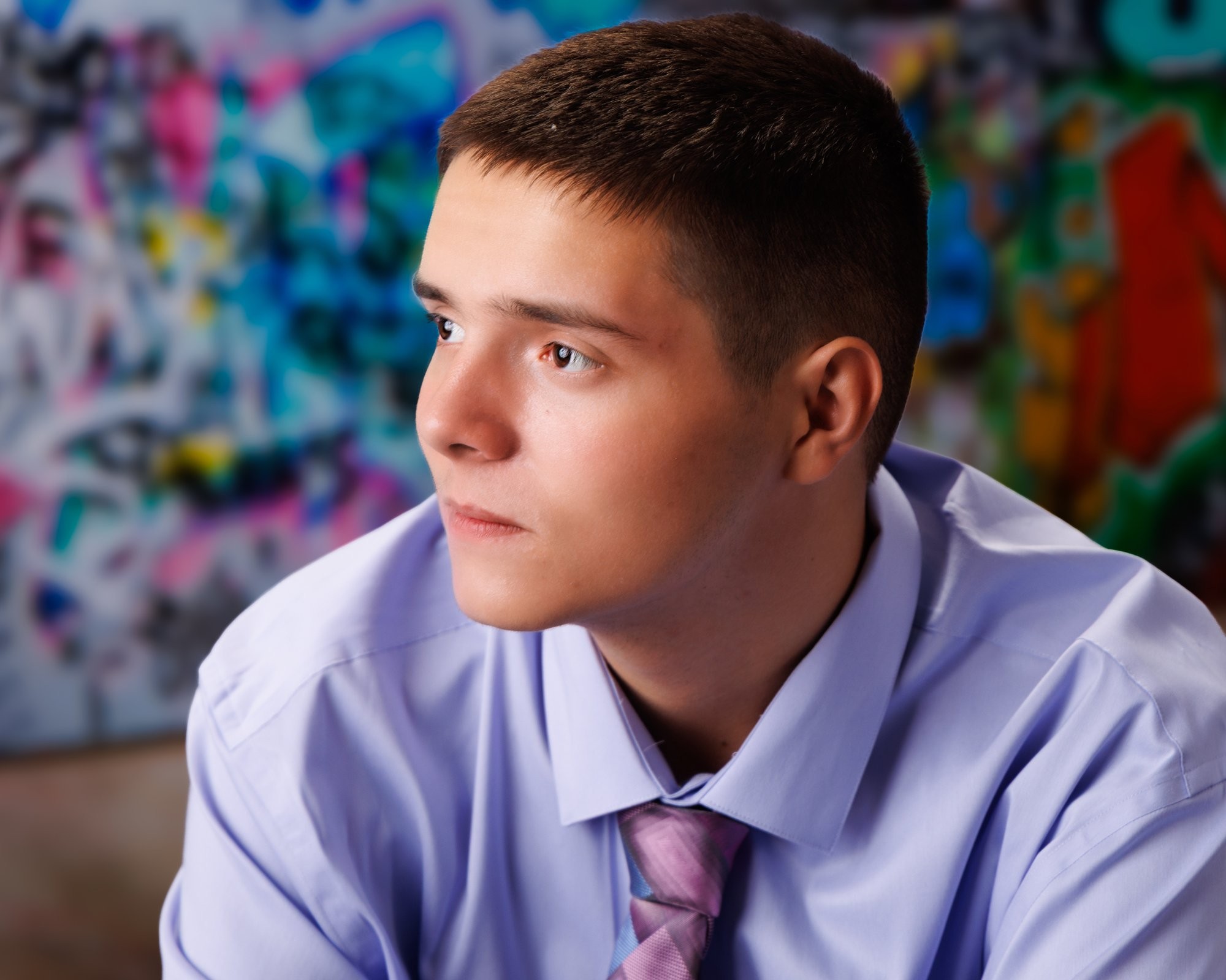 Creative Trenton senior portrait incorporating welding gear and industrial elements to highlight Downriver photography's artistic style