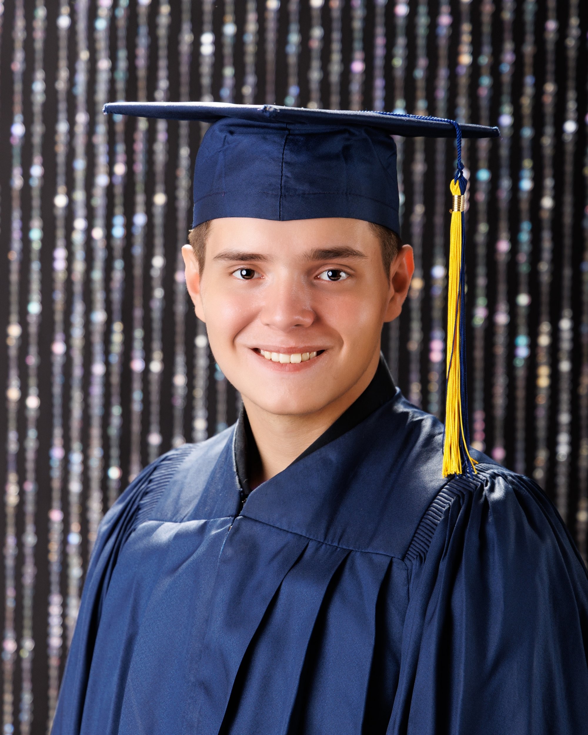 Creative Trenton senior portrait incorporating welding gear and industrial elements to highlight Downriver photography's artistic style