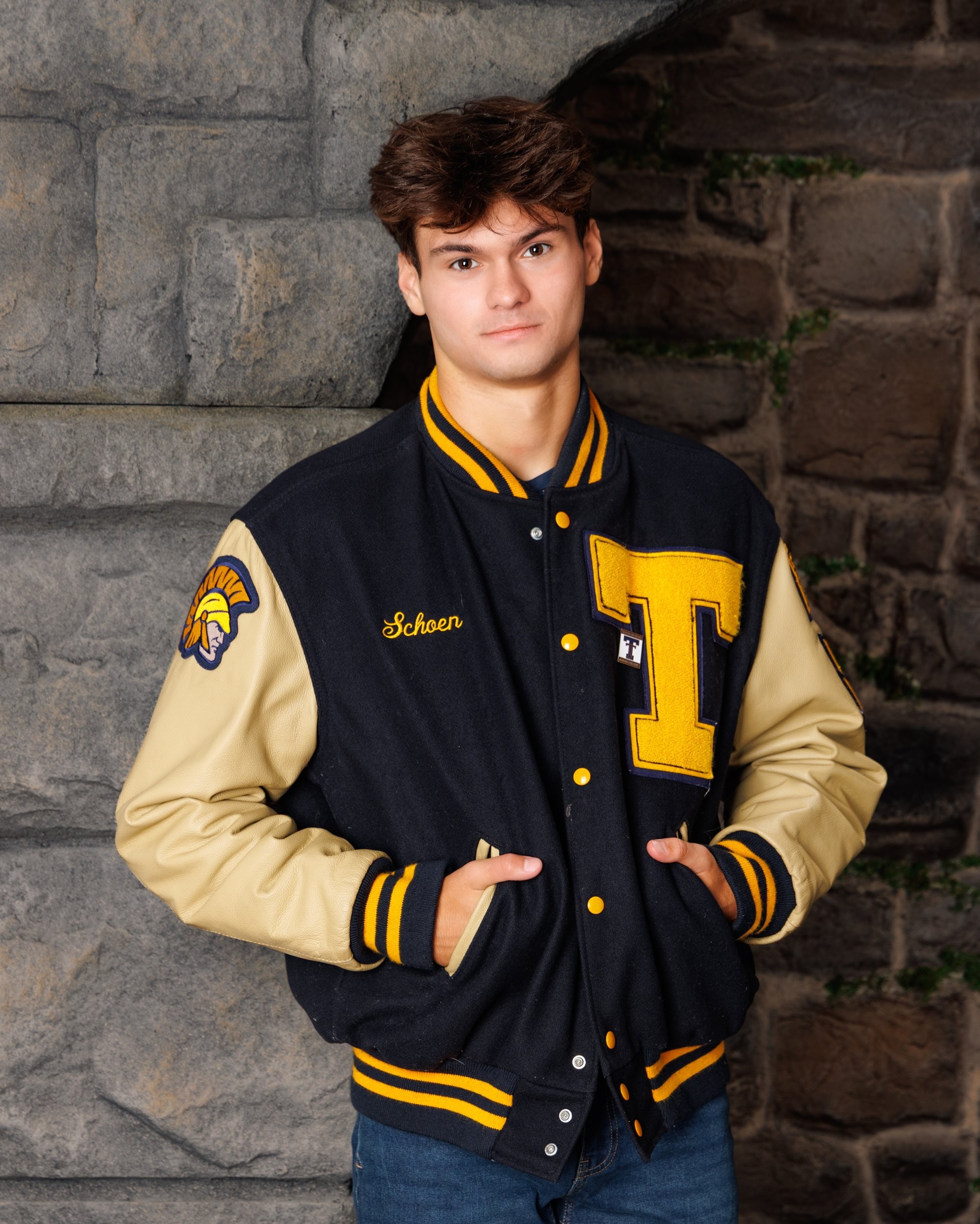 Zachary’s casual senior photo shoot with striped polo and vintage luggage in Trenton setting