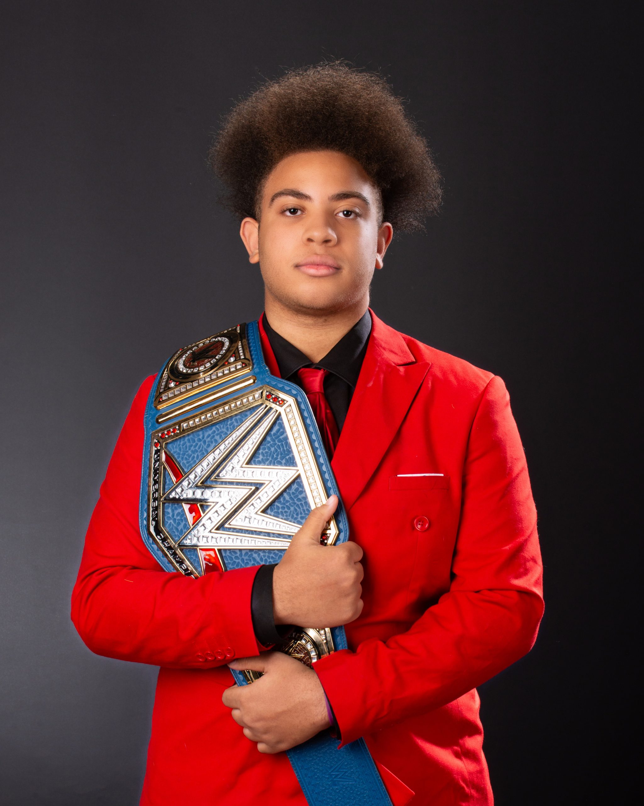 Wyandotte senior photo with '2014' overlay and championship belt